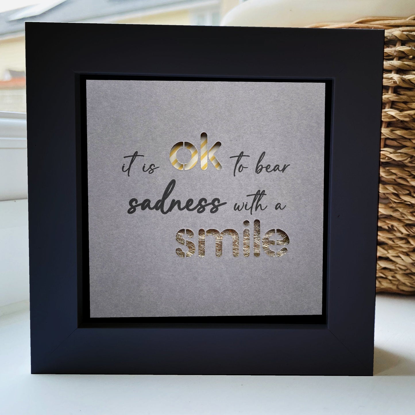 It’s OK to bear sadness with a smile Quote 1