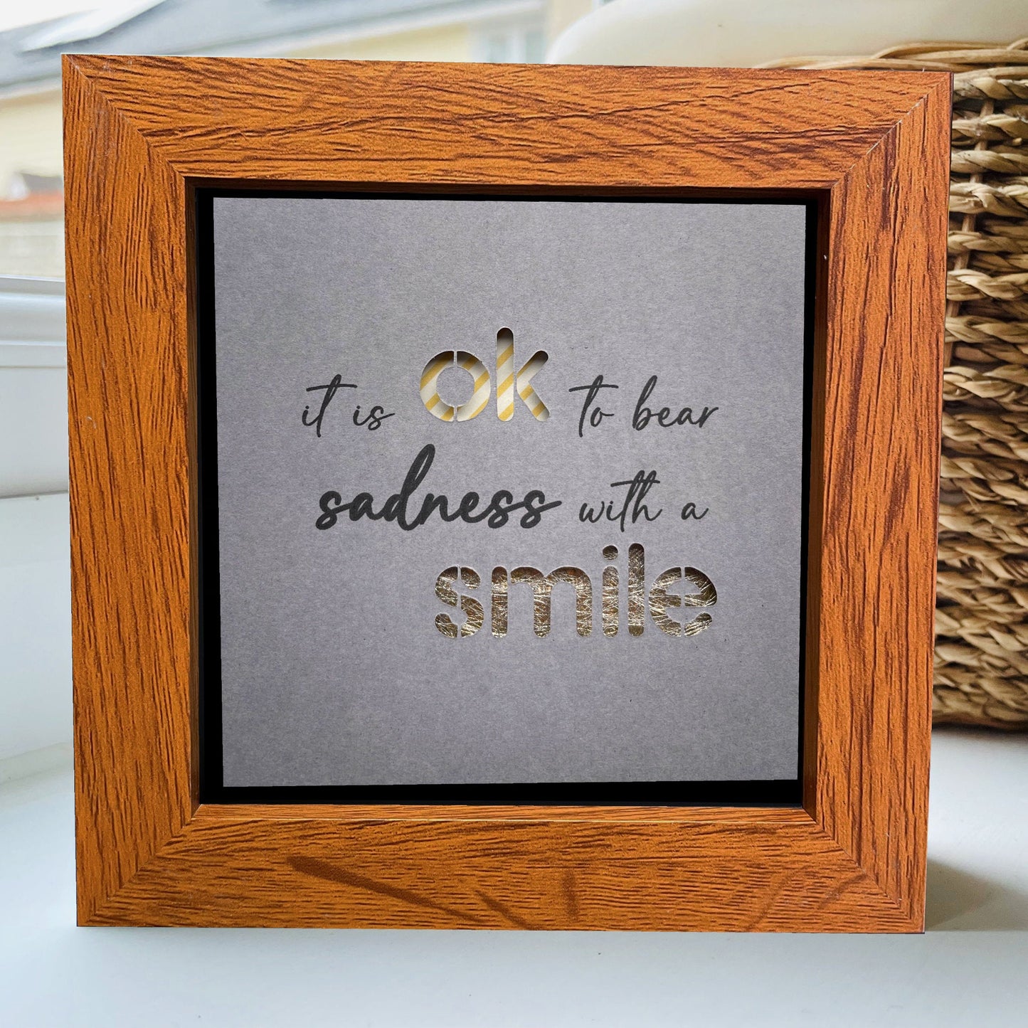 It’s OK to bear sadness with a smile Quote 1